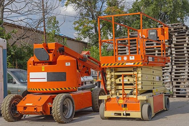 forklift transporting boxes in a busy warehouse in Bell